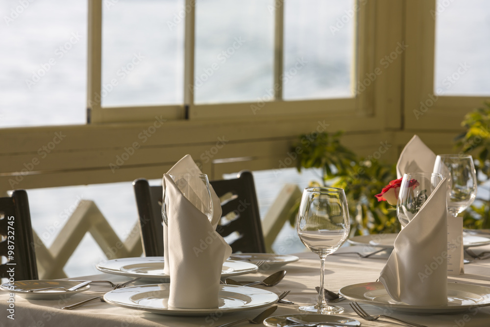 Fine restaurant dinner table place setting: napkin & wineglass,