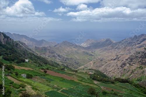 Cultivated valley surrounded by tropical mountains