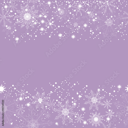 Winter background of beautiful, delicate snowflakes on a lavender background. In the center background there is a place for text, greetings, and inscriptions.