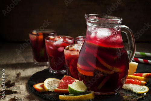Murais de parede Sangria in pitcher with slices of fruit and ice, selective focus