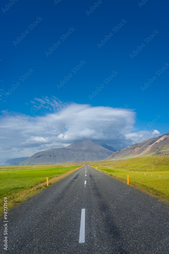 Fototapeta premium Isolated road and Icelandic landscape at Iceland, summer time