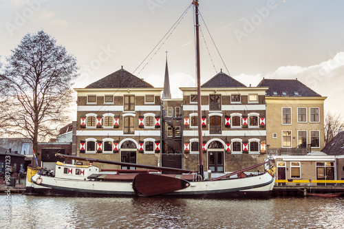 The museum harbor of Gouda in the Netherlands with monumental ships from the beginning of 1900. photo