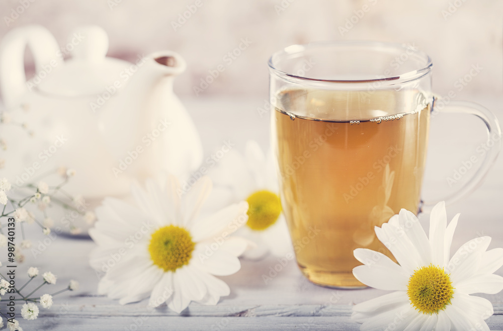 Cup of tea with chamomile flower Cup of tea with chamomile flower