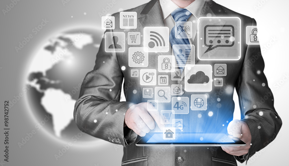 Business man using tablet PC with social media icon set Business man using tablet PC with social media icon set