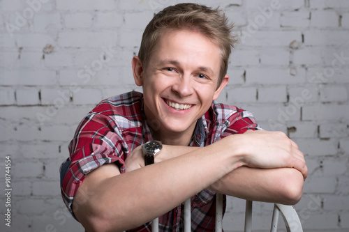 Portrait of a young man smiling   photo