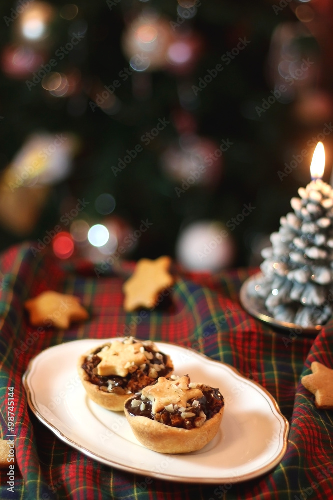 Christmas pastry filled with apples, almonds and chocolate. Star shaped cookies. Selective focus and festive background. Christmas pastry filled with apples, almonds and chocolate. Star shaped cookies. Selective focus and festive background.