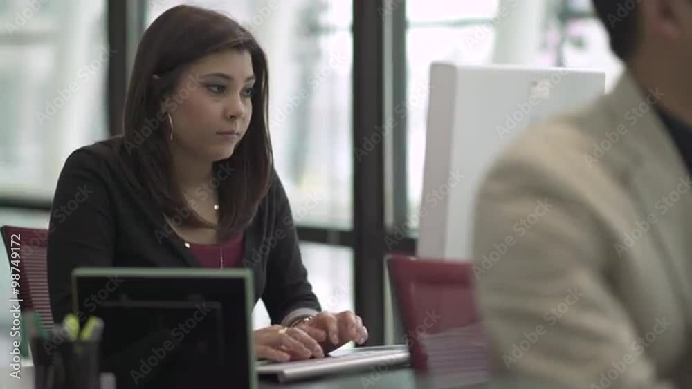 Professional in modern call center using headset and keyboard Professional in modern call center using headset and keyboard