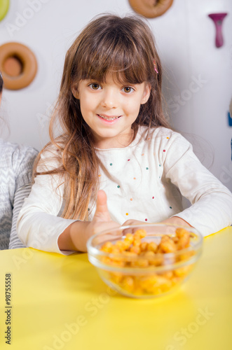 The little girl posing in a playroom photo