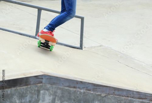 skateboarding legs at skatepark