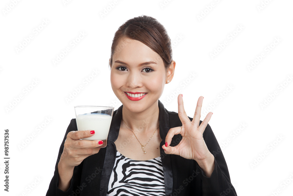 Healthy Asian woman drinking a glass of milk show OK sign Healthy Asian woman drinking a glass of milk show OK sign