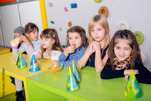 Little girls sitting and talking in the playroom
