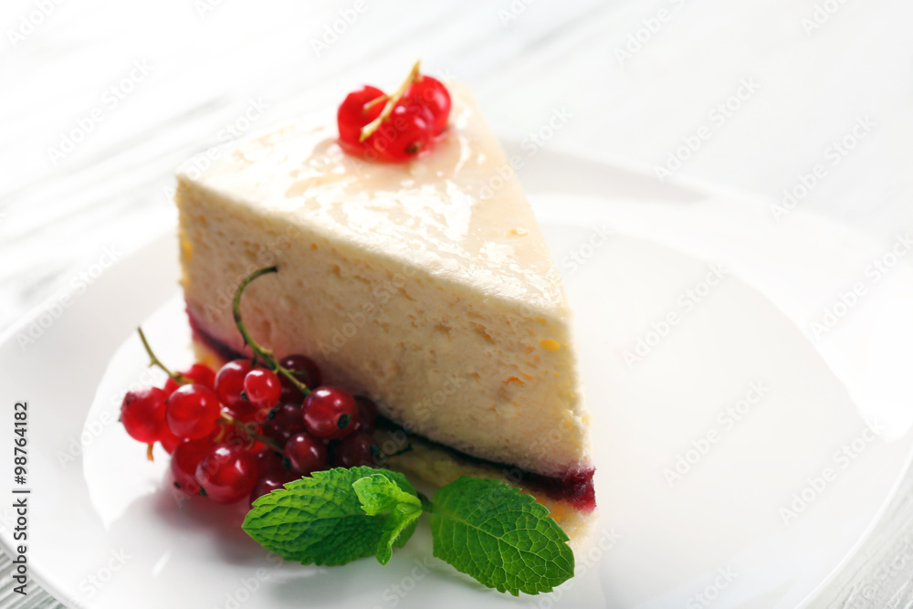 Delicious cheesecake with berries on table close up Delicious cheesecake with berries on table close up