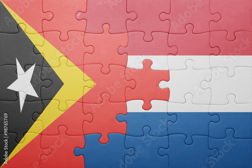 puzzle with the national flag of netherlands and east timor