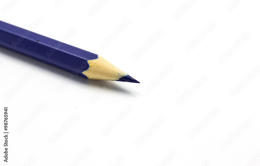 Blue pencil on white background close up Blue pencil on white background close up