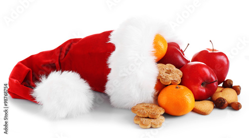 Santa hat filled with Christmas gifts, isolated on white