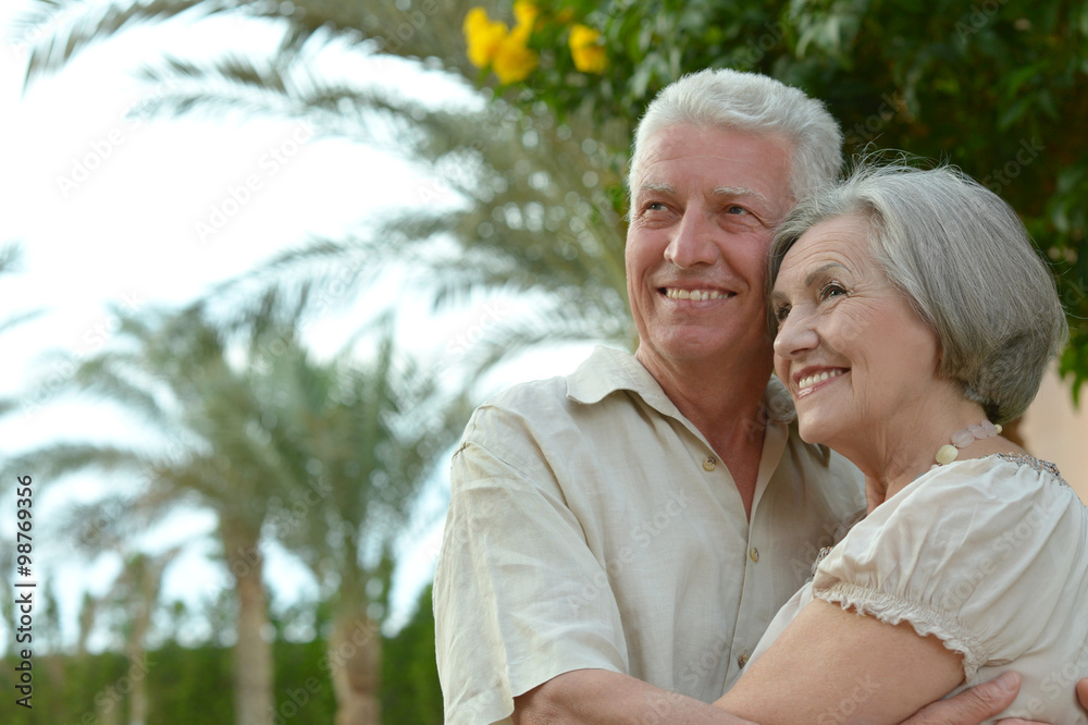 mature couple on  in summer park