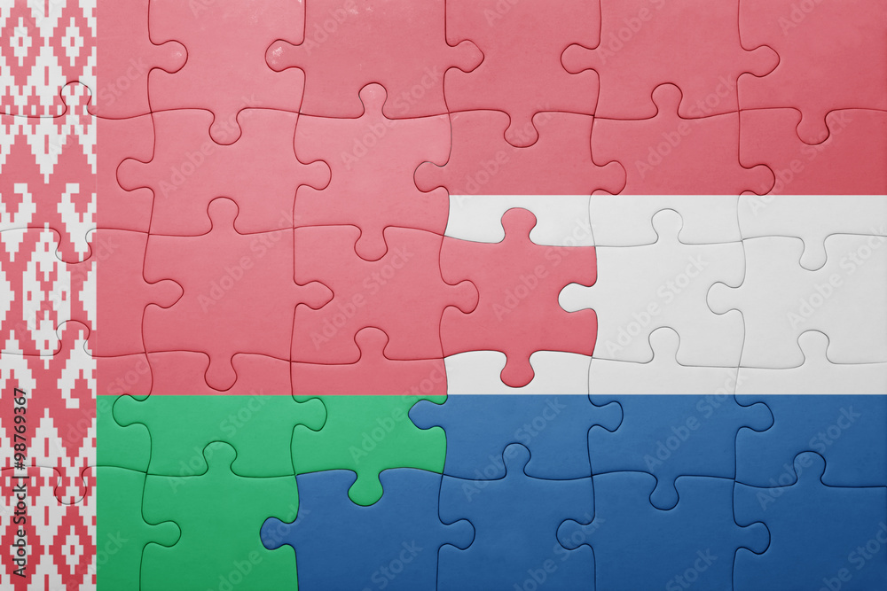 Fototapeta premium puzzle with the national flag of netherlands and belarus