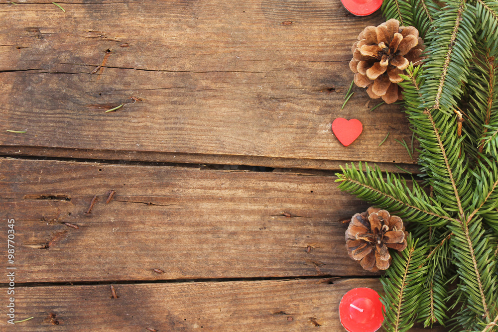 Christmas background with pine cone, candle, heart and fir branches