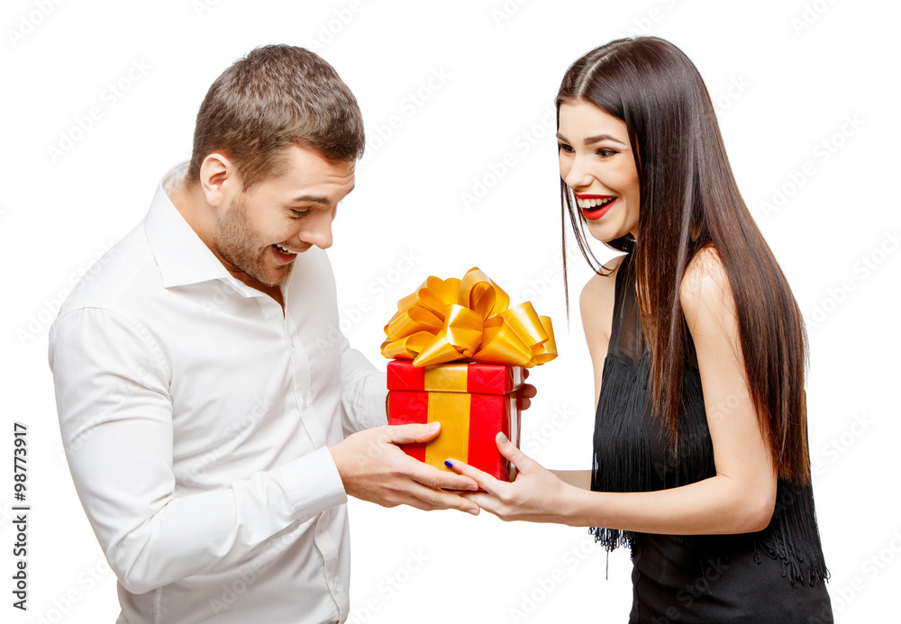 Young beautiful couple with present isolated on white Young beautiful couple with present isolated on white