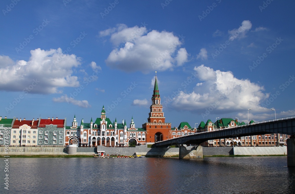 Naklejka premium Embankment Bruges and the Spasskaya Tower in Yoshkar-Ola. Russia, Mari El Republic