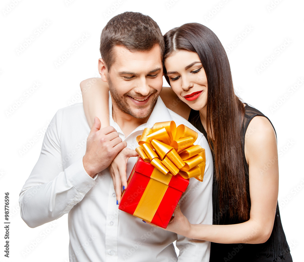 Young beautiful couple with present isolated on white Young beautiful couple with present isolated on white