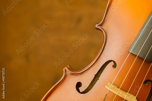 Vintage violin with old steel background with copy space