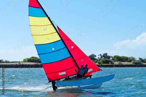 Racing Cat sailing with Blue Sky