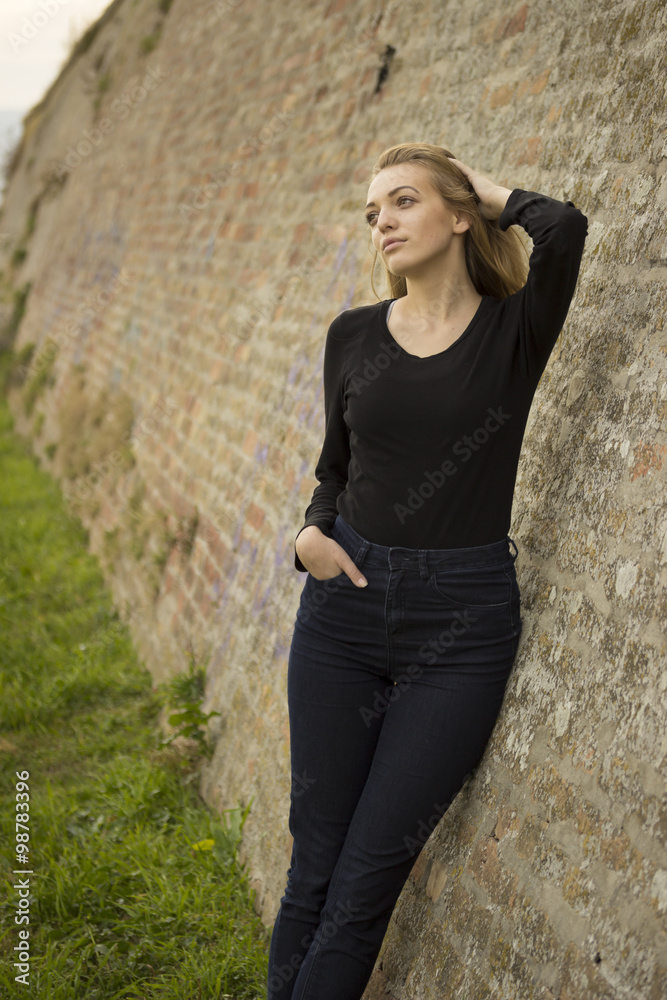 Teenage girl wearing black, posing portrait. Teenage girl wearing black, posing portrait.