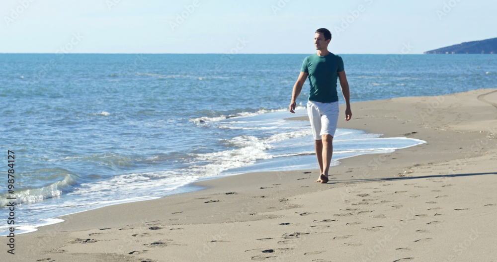 man walking on the beach Stock Video | Adobe Stock