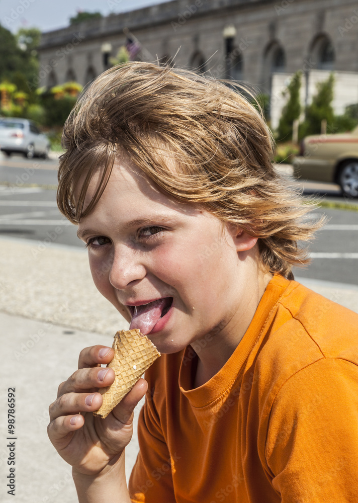 young boy eating a tasty ice cream