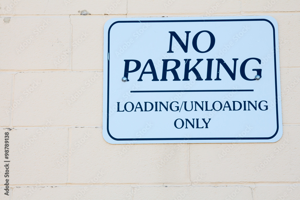 No Parking sign, loading and unloading only