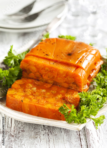 Carrot terrine. Selective focus on on the cut piece of terrine photo