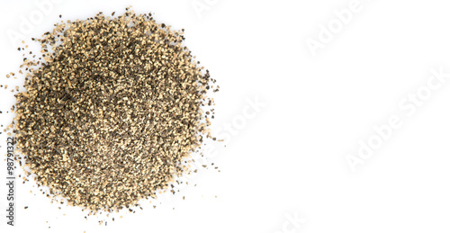 Black pepper powder over white background