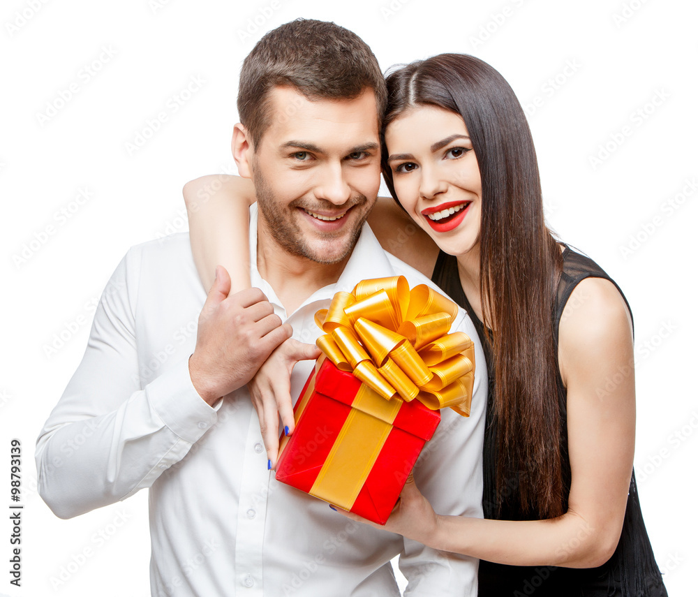 Young beautiful couple with present isolated on white Young beautiful couple with present isolated on white