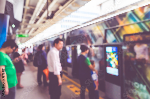 Blurred background, People travel at sky train bangkok, transpor