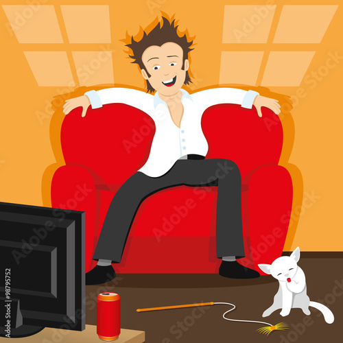 A man sitting on the couch and watching TV.
