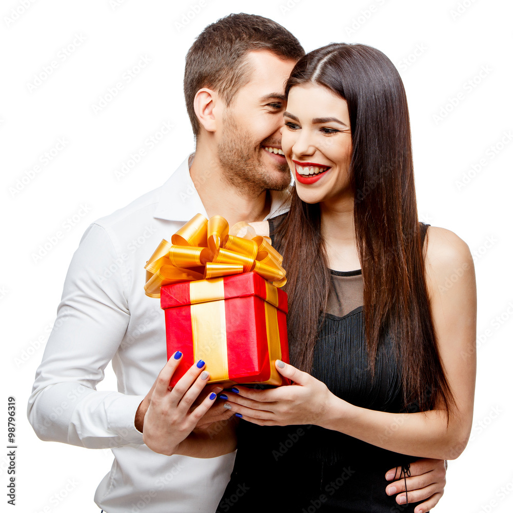 Young beautiful couple with present isolated on white Young beautiful couple with present isolated on white