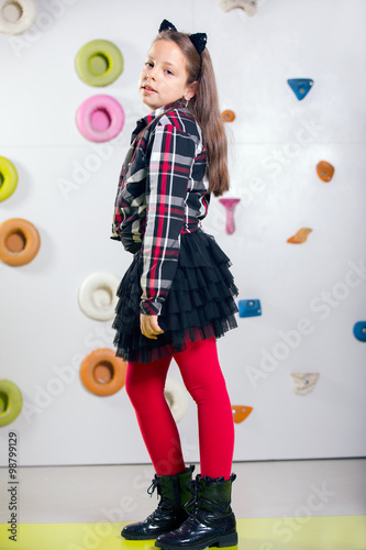 The little girl posing in a playroom photo