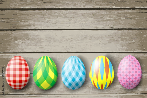Colorful easter eggs  on wood background. Vector illustration.