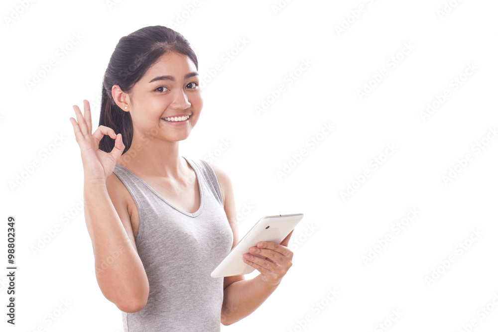 Portrait of young woman using tablet pc with showing ok sign. Portrait of young woman using tablet pc with showing ok sign.