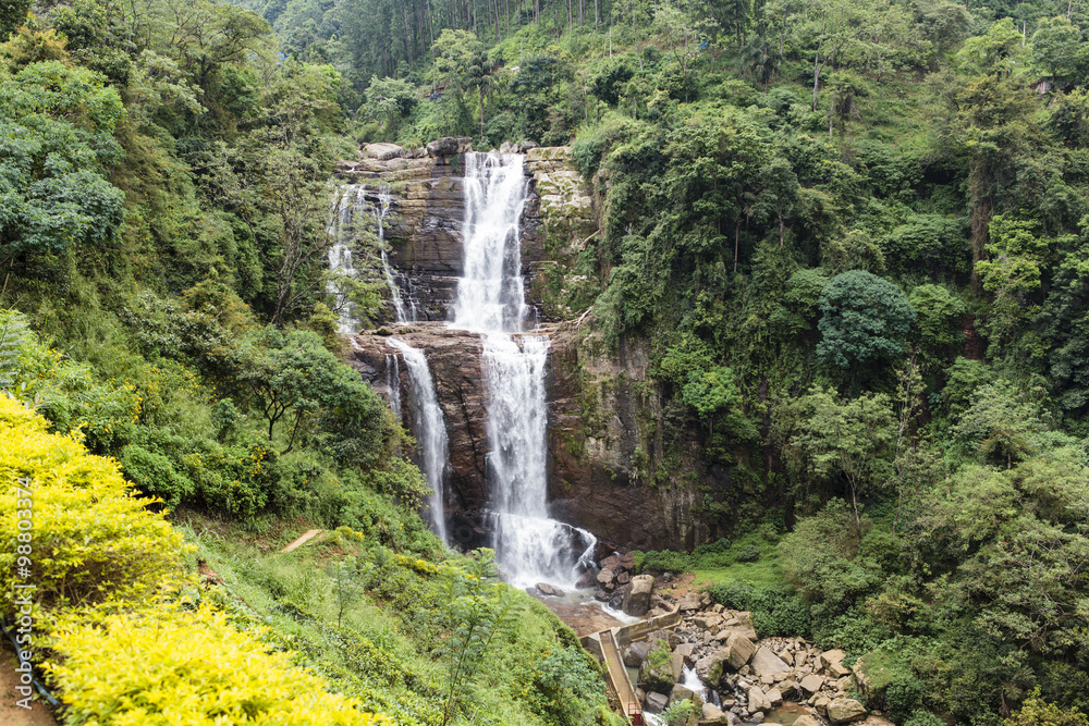 Obraz premium Waterfall and hills in the Hill Country next to Nuwara Eliya in central Sri Lanka, Asia