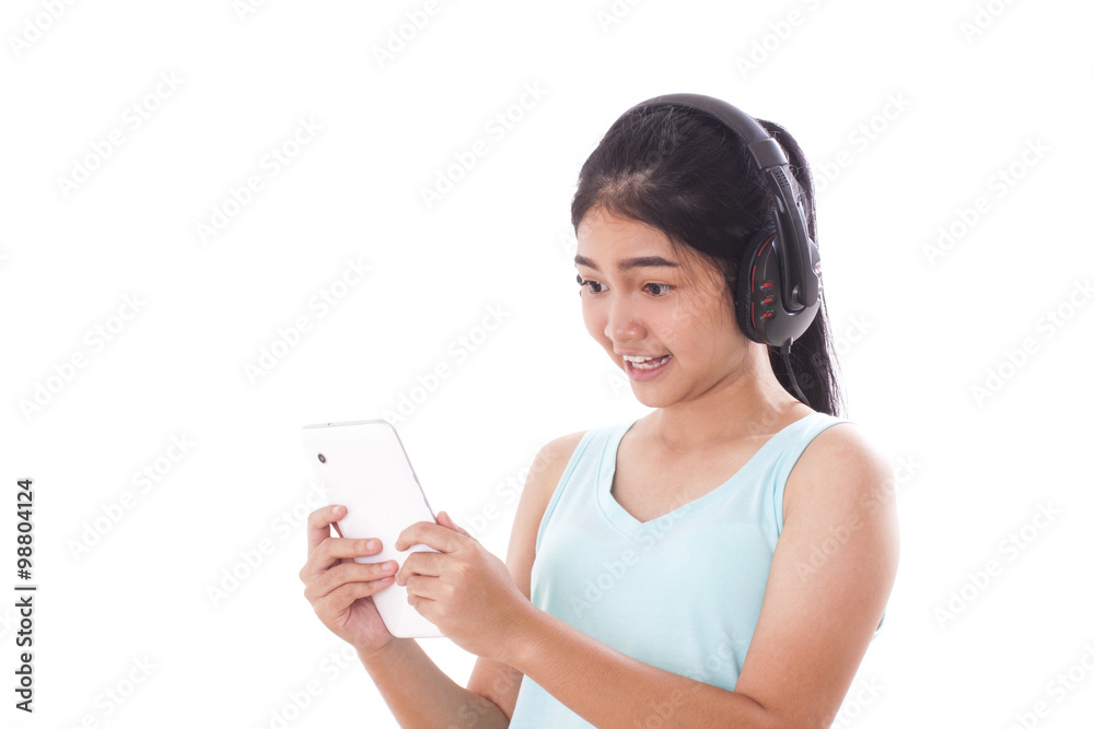 Portrait of young women using tablet pc and headphones. Portrait of young women using tablet pc and headphones.