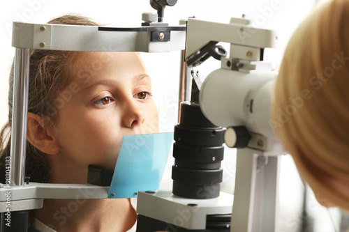 Fototapeta Naklejka Na Ścianę i Meble -  Small girl visit an optician