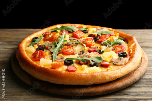 Delicious pizza on black background