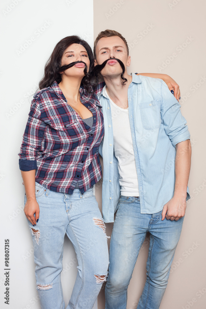 Cheerful friendly couple is making fun together Cheerful friendly couple is making fun together