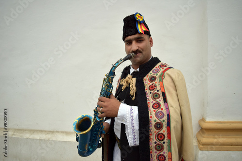 Photography Gipsy singing traditional Romanian carols at saxophone.