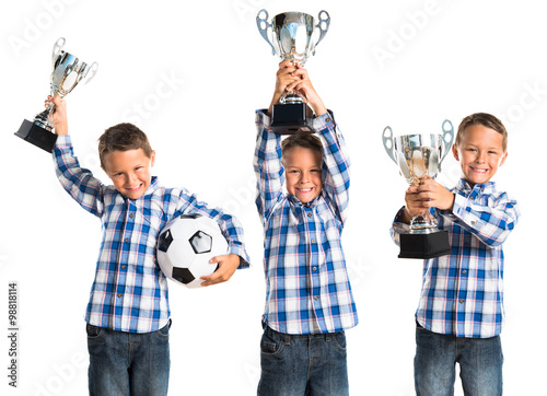Kid holding a trophy