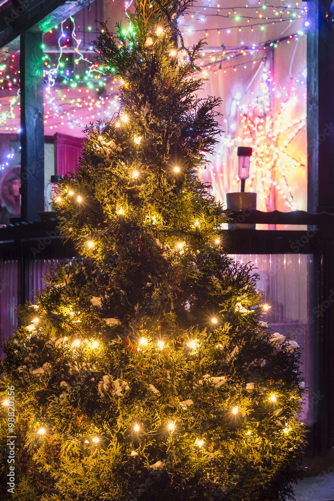Christmas tree with vintage colorful illumination.
