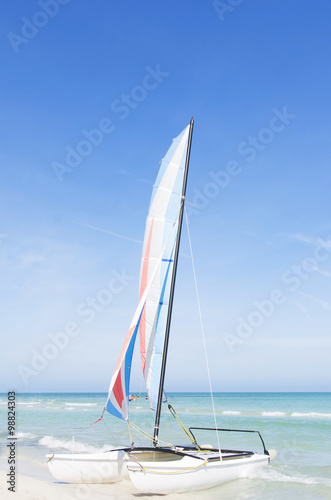 Catamaran with its colorful sails wide open on Varadero Cuban wh