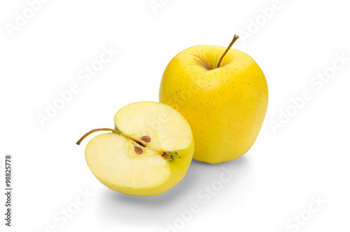Golden Delicious apple on a white background